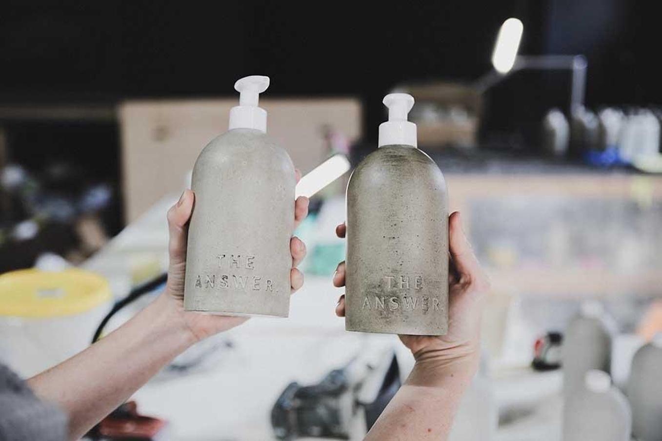 June Misfits besides Aroma image - June Misfits product image 1 - Dani holding couple of MISFIT concrete dispensers